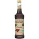 A Monin Organic Chocolate Flavoring Syrup bottle with a label.