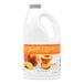 A white jug of Torani Peach Fruit Smoothie Mix with a yellow label.