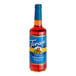 A Torani Sugar-Free Cinnamon Vanilla flavoring syrup bottle.