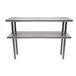 A stainless steel table with two metal shelves.