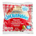 A package of Smucker's Uncrustables whole wheat peanut butter and strawberry jam sandwiches.