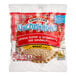 A package of Smucker's Uncrustables Whole Wheat Sandwiches with strawberry jam and peanut butter on a white background.