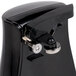 A black Proctor Silex electric can opener with a silver knife sharpener on a counter.