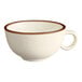 A close up of a white Acopa Keystone porcelain coffee cup with a brown rim.
