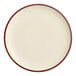 A white porcelain plate with a red rim.