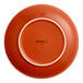 An Acopa Sedona orange porcelain plate with a white background.