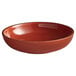 An Acopa Keystone Sedona Orange bowl with speckled rim.