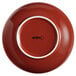 An Acopa Keystone Sedona orange bowl with a white rim.