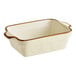 A white rectangular baking dish with brown trim.