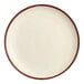 A close up of a white Acopa porcelain coupe plate with a white rim.