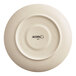 An Acopa Keystone porcelain saucer with a white rim and black text.