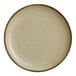 An Acopa Keystone granite gray porcelain coupe plate with a white surface.