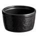 A black Acopa Keystone porcelain ramekin with a textured surface.
