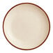 An Acopa Keystone porcelain coupe plate with a brown rim.