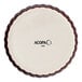 An Acopa Keystone white porcelain souffle dish with a brown edge.