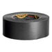 A roll of Gorilla black utility tape with a yellow label.