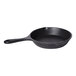 A black cast aluminum mini round skillet with a handle.