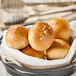 A basket of Pennant Parker House style wheat dinner rolls.