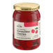 A 16-ounce jar of Hometown Provisions Maraschino Cherries with stems.