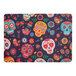 A rectangular paper placemat featuring a colorful sugar skull and floral pattern.