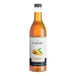 A 750 mL bottle of Capora Mango Flavoring Syrup.