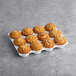 A tray of David's Cookies Banana Nut Muffins on a gray surface.
