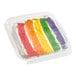 A David's Cookies rainbow cake slice in a plastic container.