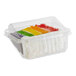 A plastic container with a slice of David's Cookies rainbow cake inside.