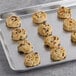 Preformed David's Cookies peanut butter chocolate chip cookies with candy on a plate.