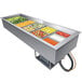 A Hatco drop-in refrigerated cold food well with several pans of food including fruit salad.