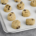 Preformed David's Cookies with chocolate chips on a tray.