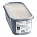 A white plastic container of G.S. Gelato Sicilian Pistachio Gelato with a lid.
