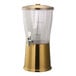 A gold and clear stainless steel and Tritan plastic cold beverage dispenser with infuser tube.