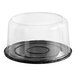 A clear plastic Baker's Lane cake display container with a clear scalloped lid.
