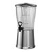 A stainless steel Service Ideas beverage dispenser with a glass lid.