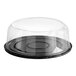 A clear plastic Baker's Lane cake container with a black low dome lid.