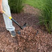 A person shoveling rocks with a True Temper square point shovel.