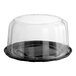A clear plastic Baker's Lane cake display container with a clear scalloped dome lid.