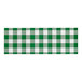 A white paper napkin band with a green gingham pattern.
