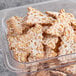 A bowl of Seviroli Sugar-Dusted Cannoli Chips with powdered sugar.