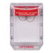 A clear box with a red and white label for a Safety Technology International Stopper II Indoor Flush-Mount Fire Pull Station Cover.