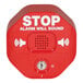 A red Exit Stopper alarm box with white text above a red button.