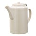 A white plastic teapot with a lid.