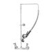 A T&S chrome wall mounted pre-rinse faucet with a hose.