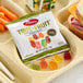 A tray of Albanese True to Fruit Exotic Fruits Gummi Bears and vegetables.