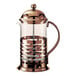 A bronze stainless steel and glass coffee press with the Service Ideas logo on the glass.