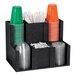 A black Dispense-Rite countertop organizer with plastic cups and straws.