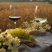 Two Stolzle Cocoon burgundy wine glasses filled with wine on a table with grapes.