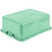 A Vollrath Traex green polypropylene container with a lid.