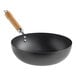A 12-inch carbon steel non-stick flat bottom wok with a wooden handle.